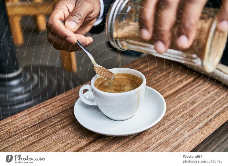 Man sitting in cafe, drinking coffee Coffee Businessman Business man Businessmen Business men Drink beverages Drinks Beverage food and drink Nutrition