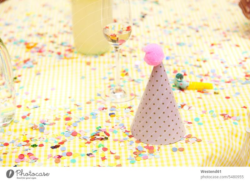 Party hat and party blower on table with confetti Birthday Birthday Celebration Birthdays Birthday Celebrations celebration Red-Letter Day Festive Day