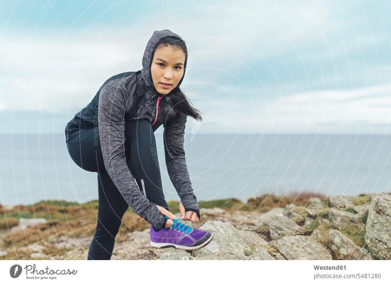 Spain, Aviles, young athlete woman running along a coastal path - a Royalty  Free Stock Photo from Photocase