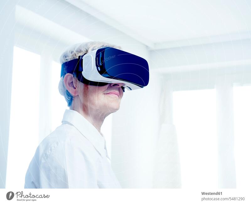 Senior woman wearing Virtual Reality Glasses VR glasses Virtual-Reality Glasses virtual reality headset vr headset vr goggles virtual reality simulator glasses