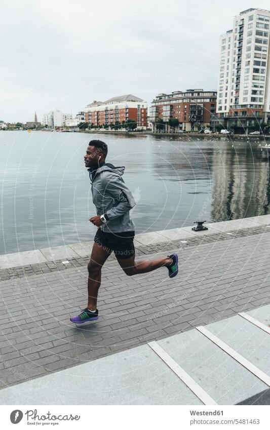 Irlenad, Dublin, young man running at waterfront promenade males exercising exercise training practising Jogging Adults grown-ups grownups adult people persons