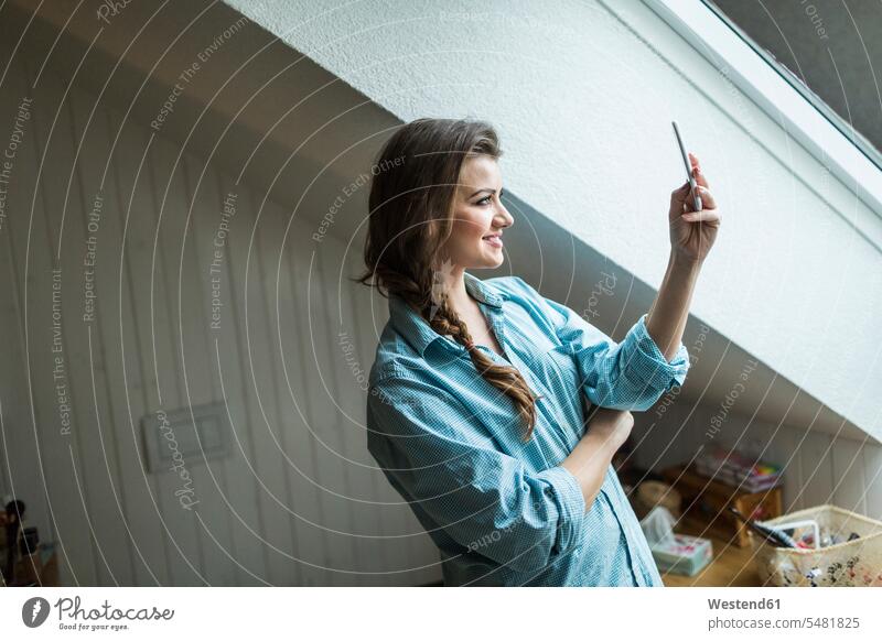 Young woman in bathroom using smartphone caucasian caucasian ethnicity caucasian appearance european telecommunication telecommunications Connection connected