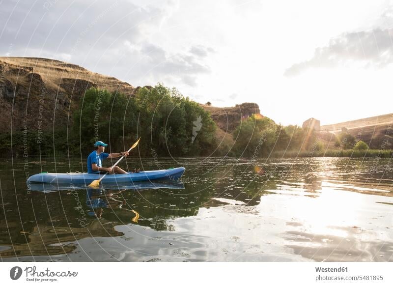 Spain, Segovia, Man in a canoe in Las Hoces del Rio Duraton paddling paddle leisure free time leisure time kayaking River Rivers canoeist canoeists kayaker