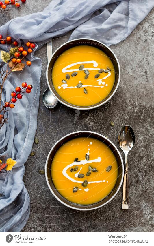 Creamed pumpkin soup in black bowl garnished mashed puréed healthy eating nutrition creme of vegetable soup Sauce Sauces Bowl Bowls cloth clothes autumnal