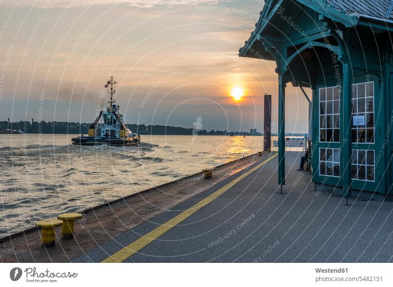 Germany, Hamburg, Mooring area Neumuehlen, Towboat, Elbe river at sunset sunsets sundown evening light Neumuhlen afterglow Afterglow Vista evening mood