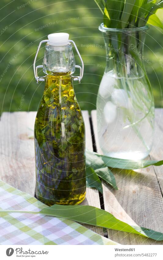 Swing top bottle of chopped ramson in olive oil Glass Bottle Glass Bottles healthy eating nutrition aroma flavour aromatic ingredient ingredients sliced