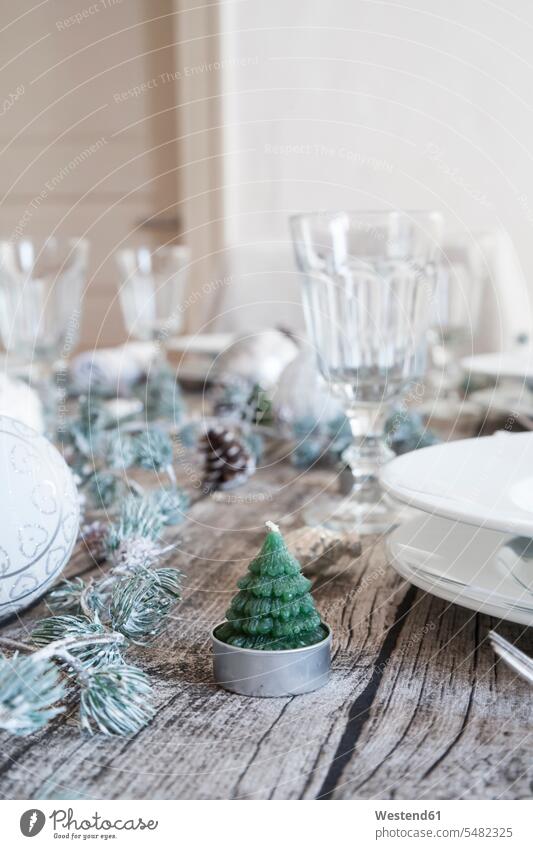 Tea light shaped like a fir on laid table at Christmas time Wine Glass Wine Glasses Wineglass Wineglasses Christmas decoration Christmas decorations Germany