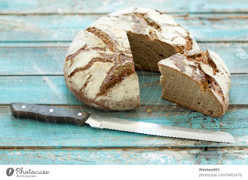 Rustic rye bread on blue wood, knife Rustic Rye Bread loaf of bread loaves loaves of bread Loafs Of Breads Bread Loafs Loaf Of Breads baked Baked Food wooden