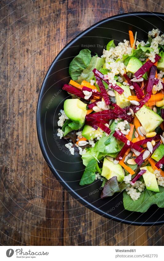Bowl of autumnal salad with lettuce, carrots, avocado, beetroot, pumpkin and sunflower seeds, pomegranate and quinoa food and drink Nutrition Alimentation