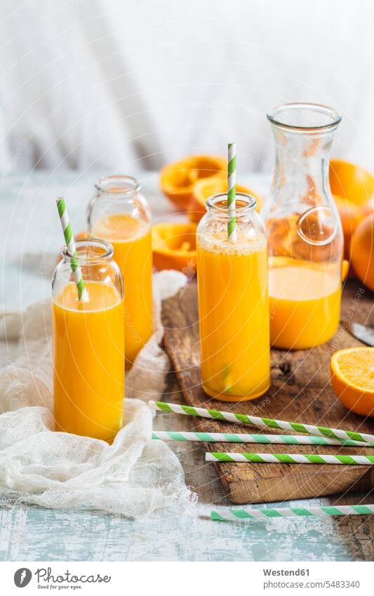 Sliced oranges and glass bottles of freshly squeezed orange juice food and drink Nutrition Alimentation Food and Drinks Glass Drinking Glasses tasty savoury