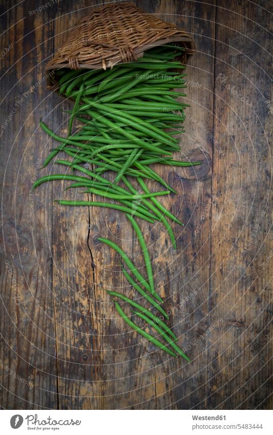 Wickerbasket and green beans on dark wood Freshness fresh uncooked food and drink Nutrition Alimentation Food and Drinks rustic close-up close up closeups