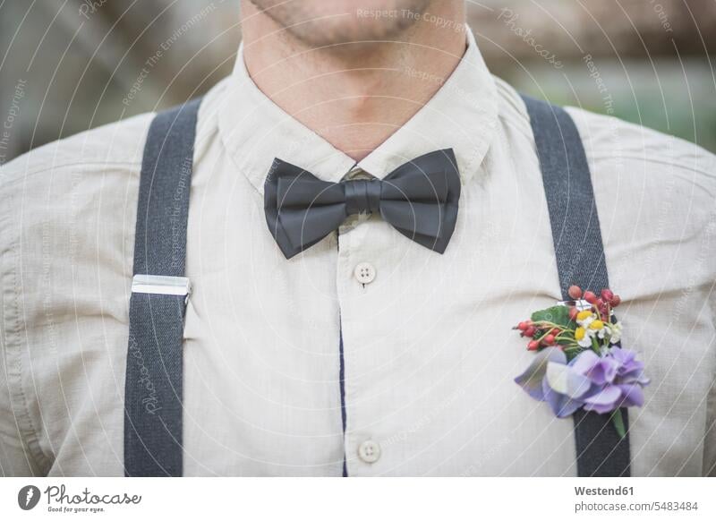 Close-up of groom wearing floral decoration Flower Flowers bridegrooms suspender suspenders Wedding getting married marrying Marriage Celebration Celebrations