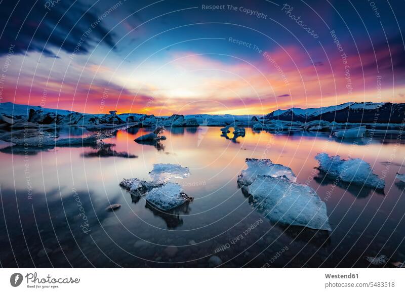 Iceland, Vatnajokull National Park, Sunset, icebergs floating in Jokulsarlon Ice Lagoon glacial ice evening light cold Cold Weather Cold Temperature chilly