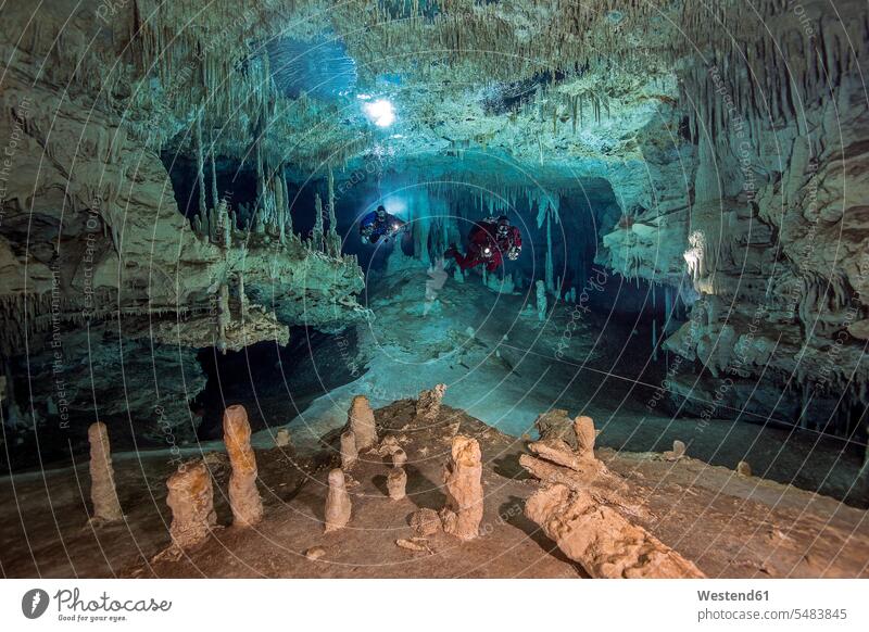 Mexico, Yucatan, Tulum, cave divers in the system Dos Pisos two people 2 2 persons 2 people two persons diving suit diving suits wetsuit wet suit wetsuits