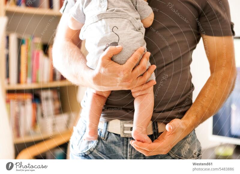 Baby girl on her father's arms caucasian caucasian ethnicity caucasian appearance european carrying daughter daughters European parent single parent one parent