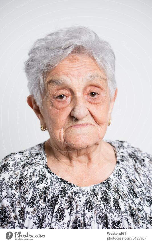 Portrait of sad senior woman in front of white background caucasian caucasian ethnicity caucasian appearance european portrait portraits casual leisure wear