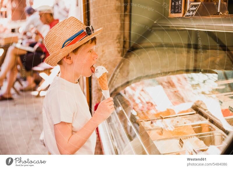 Boy eating ice cream boy boys males child children kid kids people persons human being humans human beings Sweet Food sweet foods food and drink Nutrition