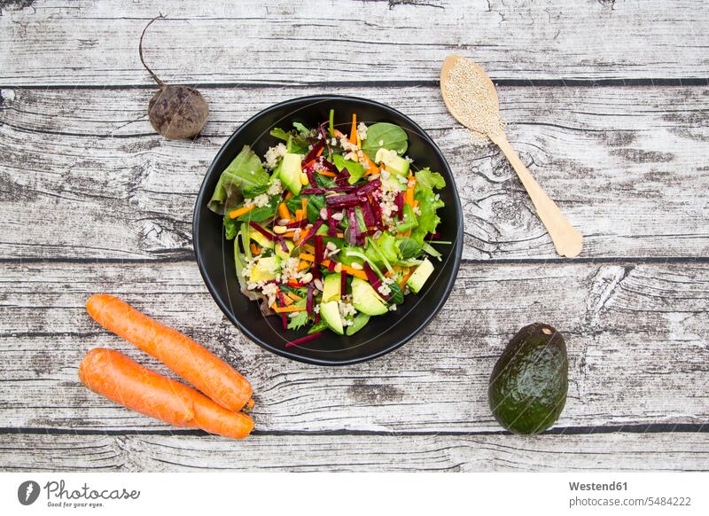 Bowl of autumnal salad with lettuce, carrots, avocado, beetroot, pumpkin and sunflower seeds, pomegranate and quinoa food and drink Nutrition Alimentation