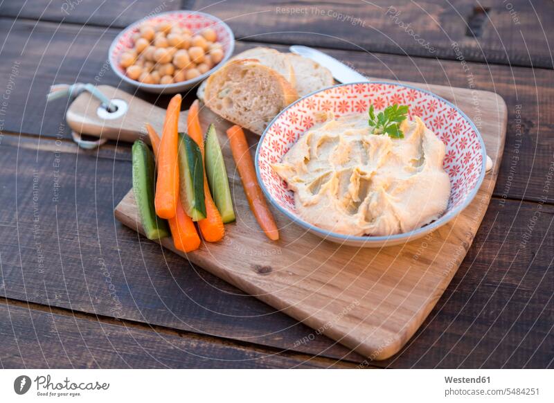 Hummus, chick peas, carrots, cucumber, baguette preparation prepare preparing ingredient ingredients Chickpea Chick Peas Cicer arietinum Chickpeas arabian