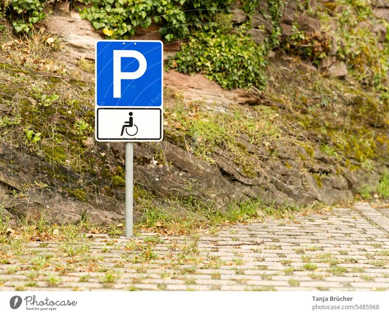 Blue traffic sign Parking for disabled persons with parking permit for severely disabled persons (symbol wheelchair user) Parking space for severely disabled