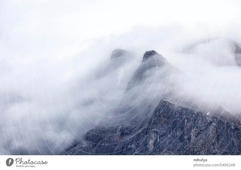 mountain Zugspitze peaks in fog alpine Alps top rock mist weather landscape nature outdoors outside nobody no people background dramatic summer tourism hiking