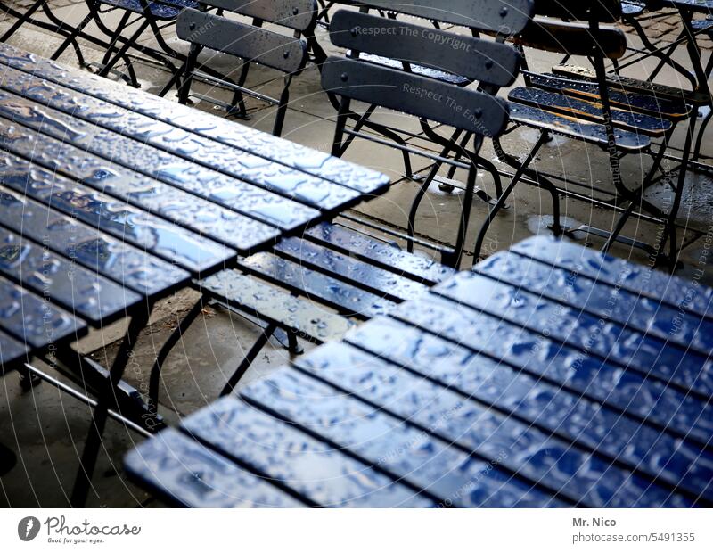 outdoor dining downpour rain atmosphere Surface Restaurant Garden table Drops of water Bad weather Wooden table Empty Rainwater Damp Sidewalk café Terrace