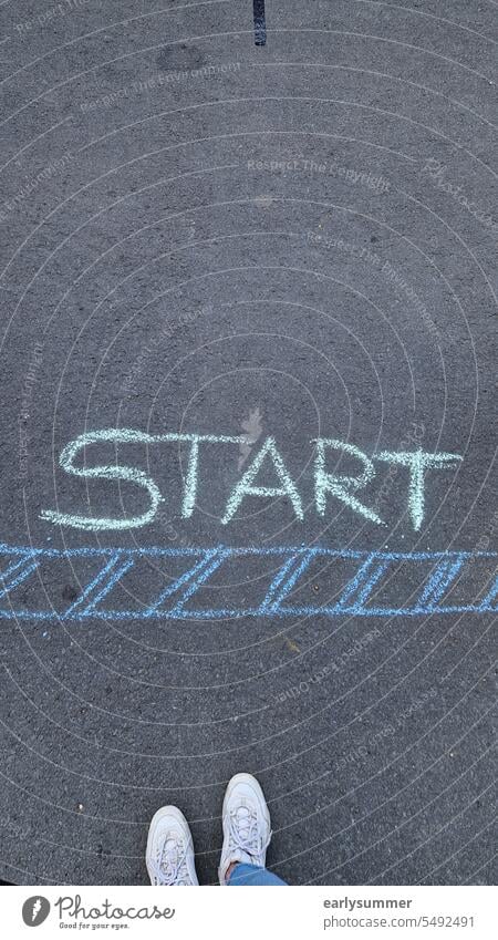 Start with a starting line drawn in chalk on the road with a person's shoes in view launch Starting line Apprentice fresh start take off training