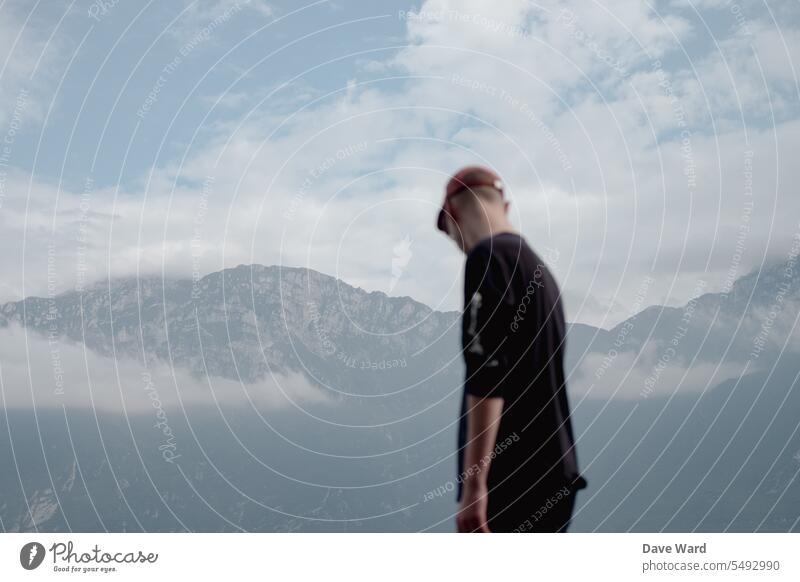 Man standing in front of mountains on Lake Garda Exterior shot Mountain Nature Landscape Vacation & Travel Sky Clouds