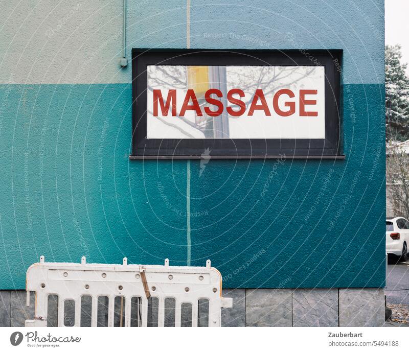 Sign massage on blue facade Massage sign Facade Blue Turquoise Town Suburb urban service Commerce writing Red Signs and labeling Letters (alphabet) Word