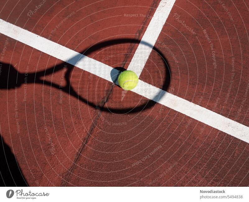 Tennis racket shadow and ball on a courtyard Racket Tennis court Tennis ball Tennis Racquet racquet sports no people Still Life Shadow shadows object outdoors
