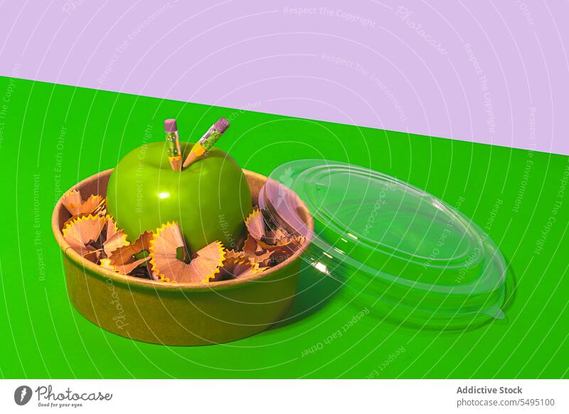 Delicious apple with pencil shavings in lunch box zero waste green healthy food organic fresh concept school diet container natural reuse creative fruit vitamin