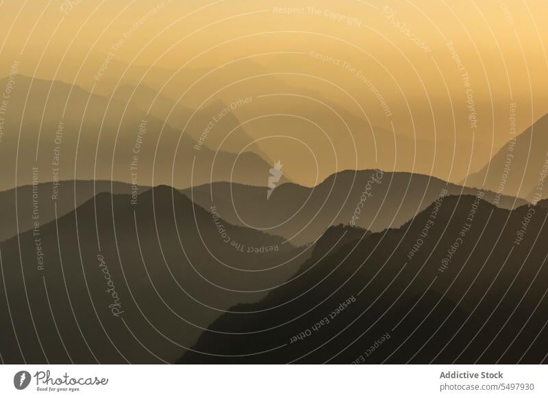 Mountain formation during amazing sundown mountain rocky ridge sunset landscape range silhouette nature Maggiore valley picturesque scenery environment yellow