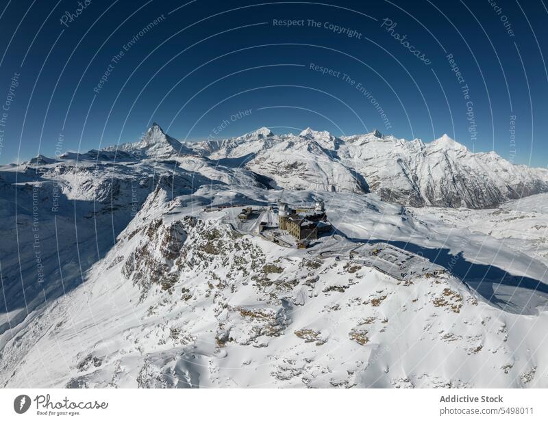 Snowy ski resort on mountains in sunlight panorama snow switzerland nature landscape range vacation white bright valley travel cold beautiful environment