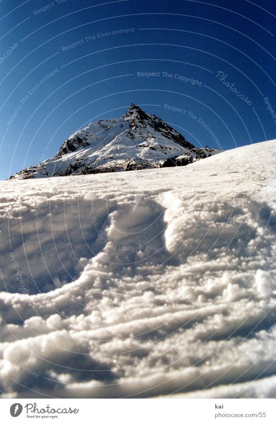 MountainWinter01 Alps Snow Nature Cloudless sky Beautiful weather Peak Ski run Worm's-eye view Portrait format Deserted Upward Copy Space top Snowscape