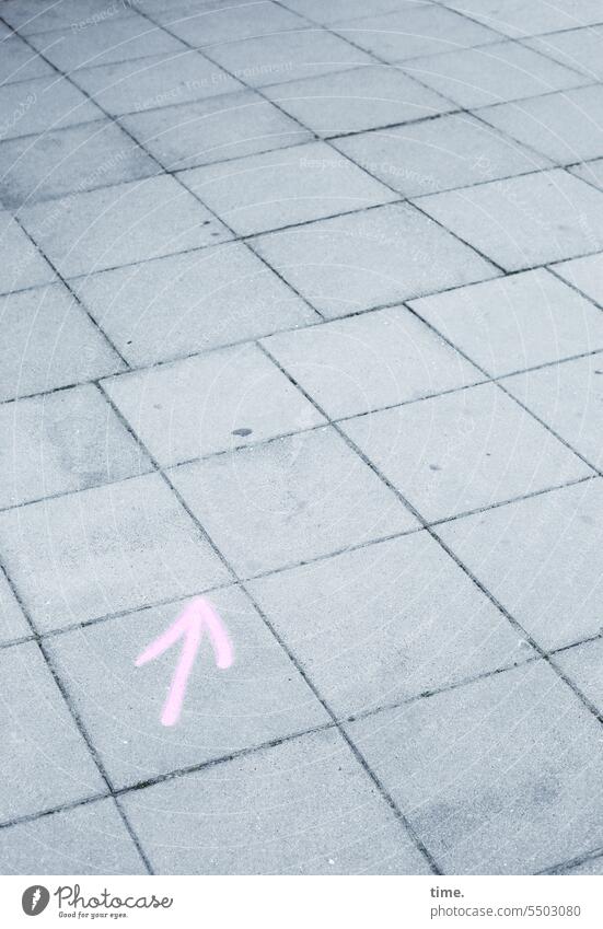 Drinkje bej Inkje | here along Arrow paving Sign Base plate Direction Orientation Pink Gray graffiti painted on urban Sidewalk off squares