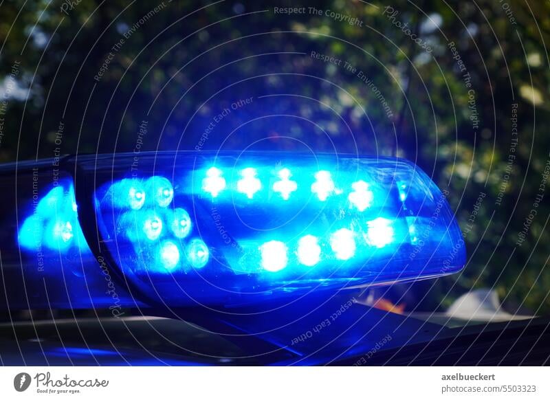 https://www.photocase.com/photos/5503323-emergency-blue-light-on-police-car-or-rescue-vehicle-at-night-photocase-stock-photo-large.jpeg