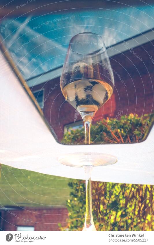 Wine glass reflected in a smartphone Glass Alcoholic drinks Table reflection Beverage Reflection Vine White wine Close-up Exterior shot Building