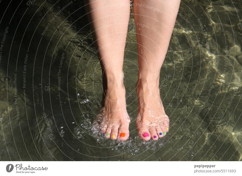 With colorful toenails - woman takes cold foot bath at lake Colorful toenails Feet up feet Legs Woman Barefoot Toes Colorful toes Toenail Tip of the toe