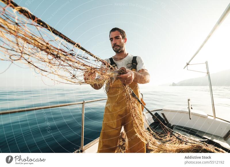 10,400+ Men Fishing Boat Stock Photos, Pictures & Royalty-Free