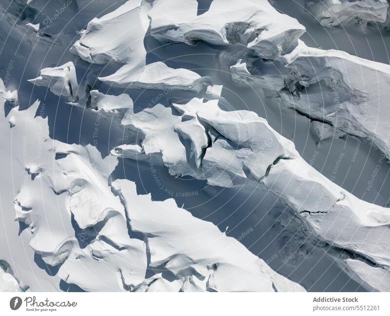 Snow textured surface in wintertime mount snow nature highland landscape rough Zermatt ridge Switzerland scenic atmosphere uneven mountain geology cold weather