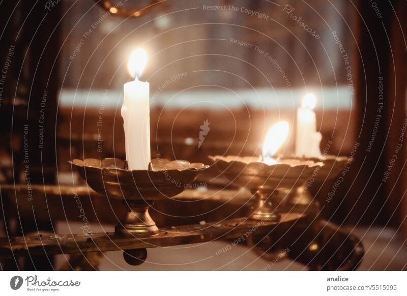 Set of burning candles in a church Candle church candles Candlestick Candle holder Burn Illuminate Light Fire Church Interior shot Decoration
