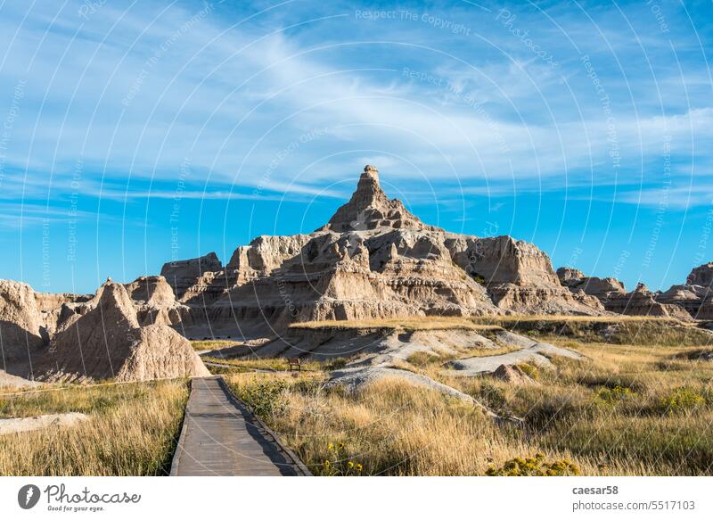 A trail in Badlands National Park that leads to rugged hills Desert Hill Promenade off view Dry Sandstone Mountain Peak Nature Landscape Picturesque Erosion