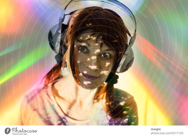 Absorbed, a woman listens to music with headphones! Woman Headphones portrait Lifestyle Listening Smiling Prismatic colors Shadow Light