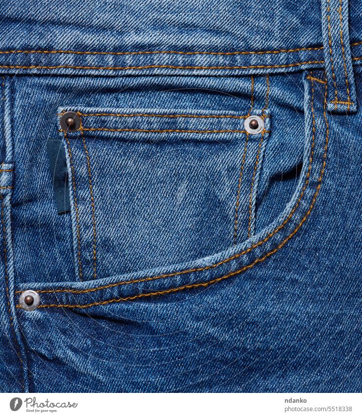 Blue jeans front pocket with buttons, close up pants seam stitch textile texture trousers wear apparel background blue canvas casual closeup cloth clothing