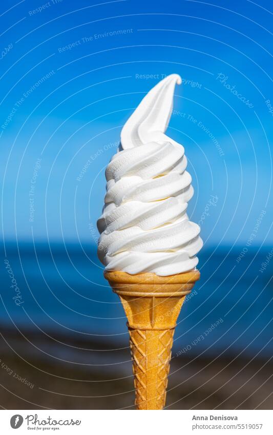 Soft vanilla ice cream with chocolate stick soft cone hand whippy soft ice cream takeaway treat confectionery creamy whipped whipper cornet milk icecream tasty