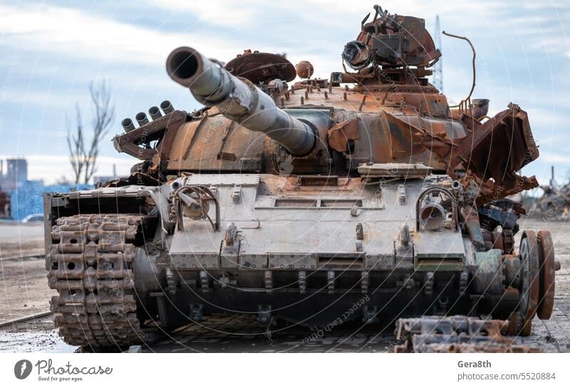 damaged military tank on a city street in Ukraine Donetsk Kherson Lugansk Mariupol Russia Zaporozhye abandon abandoned armor attack bakhmut blown up bombardment