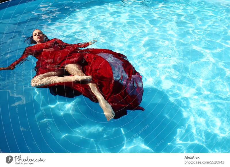 Denise - portrait of young beautiful woman with red ball gown in swimming pool Long-haired be afloat Dive Fresh Refreshment Light (Natural Phenomenon) Waves