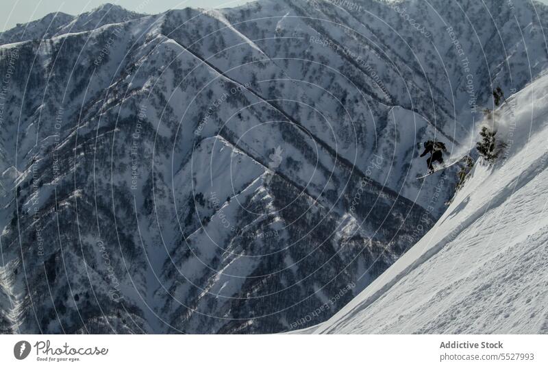 Person riding snowboard on hill person snowboarding slide sportsman hills winter white view cold frosty nature travel mountains tourism adventure journey