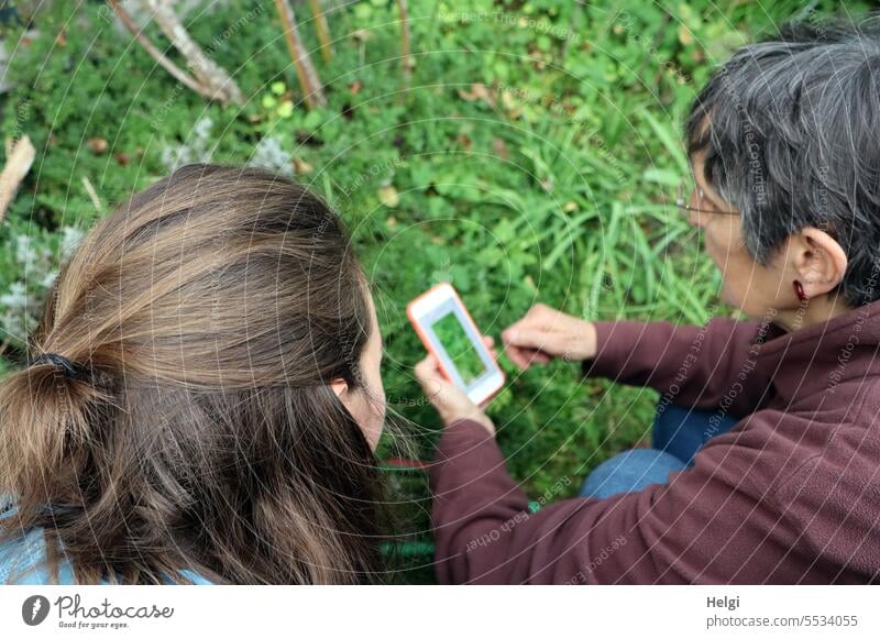 Wide land | Plant identification by smartphone Human being Woman two Garden Bird's-eye view Detail Hair and hairstyles Feminine Adults Brunette Exterior shot