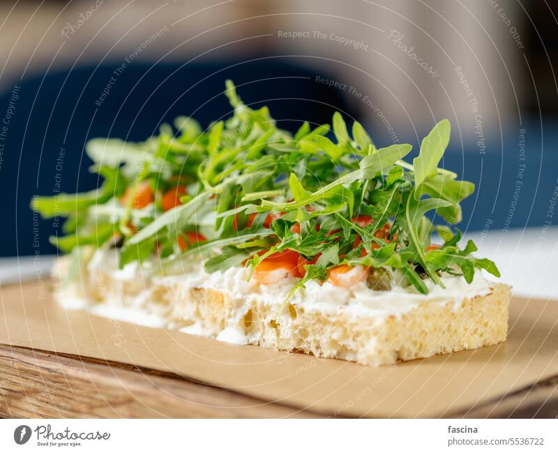 bruschetta with salmon and arugula appetizer recipe sandwich salmon delicious Italian gourmet fresh toppings healthy toast bread seafood background party